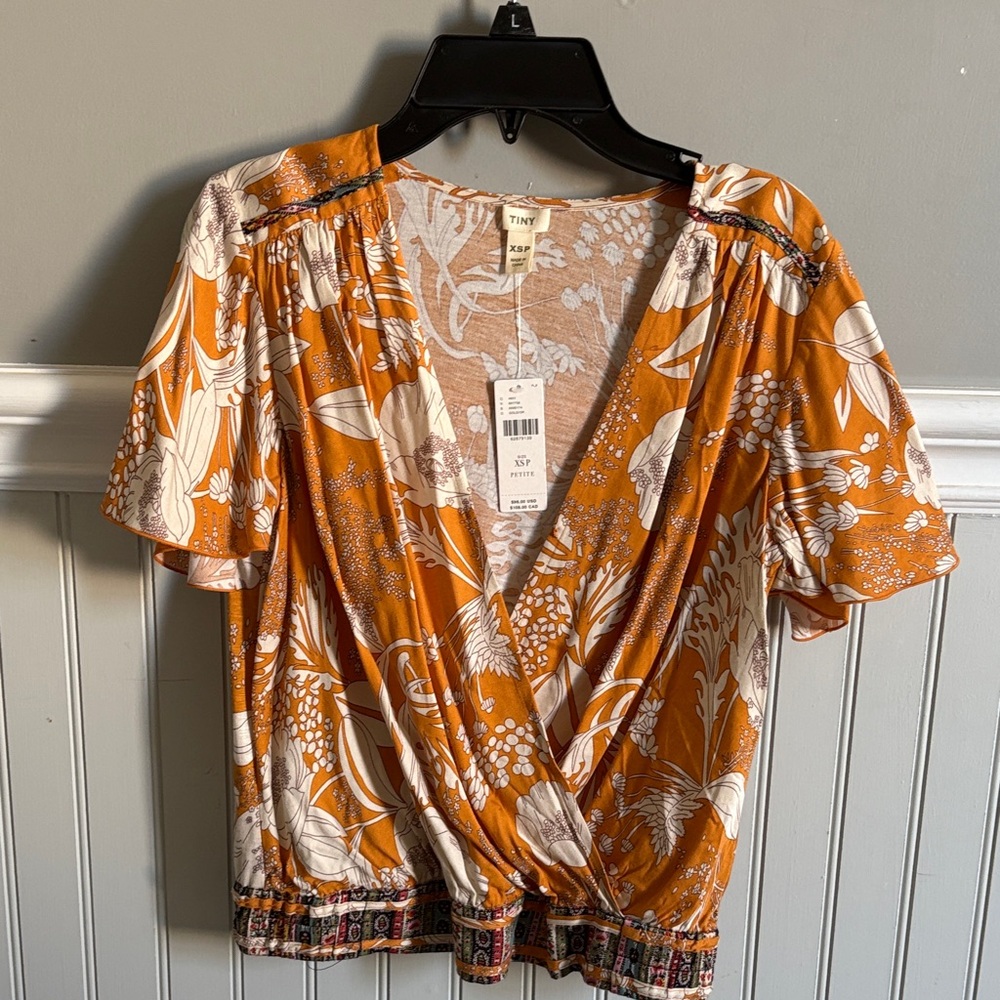 Trendy Orange Floral Wrap Blouse